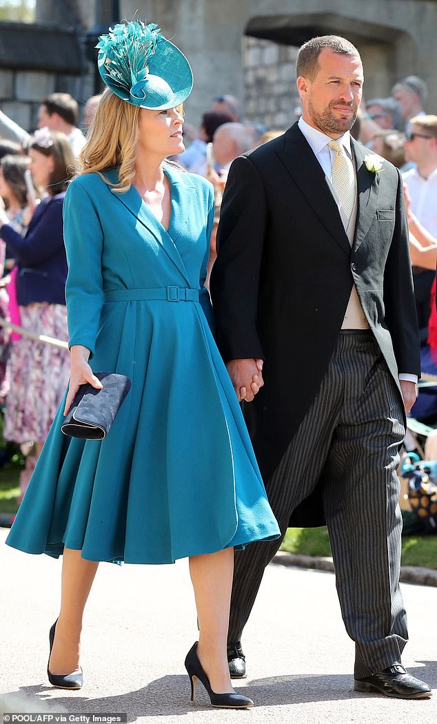 Peter Phillips and Autumn Phillips arrive for the wedding ceremony of Prince Harry and Meghan Markle at St George