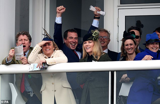 Victory! Peter Phillips celebrated behind his estranged wife Autumn as they took in the action at Cheltenham this afternoon
