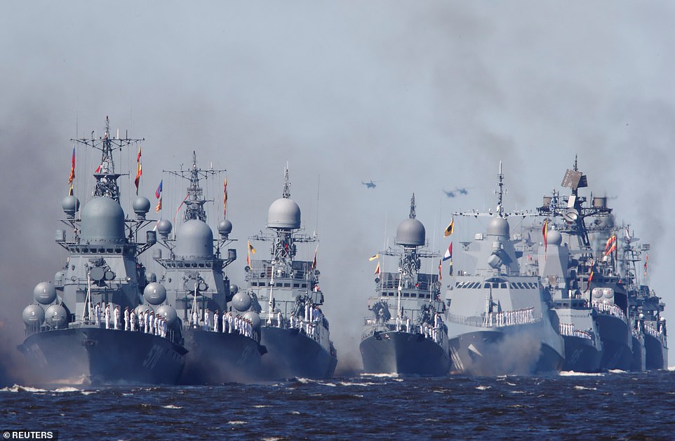 Russian warships sail during the Navy Day parade in Kronstadt near Saint Petersburg, Russia, today as part of the day