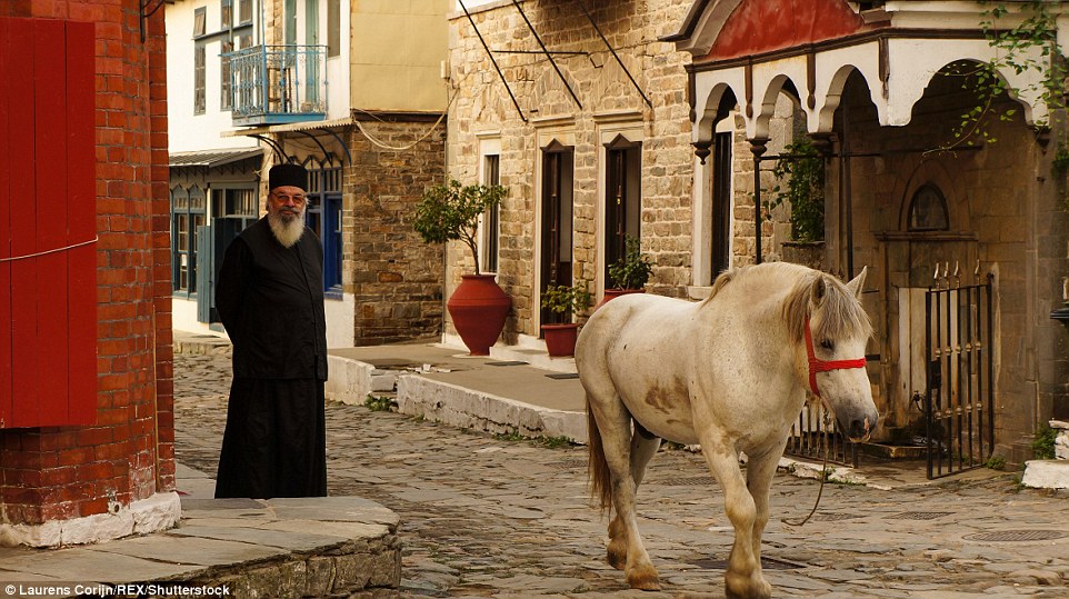 An unattended horse wanders through the streets of Karyes
 Mount Athos. Along with woman and children, female animals are also banned from the mountain