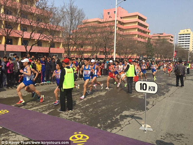Many people turned up to cheer on the runners, but some were confused by the Western art of high-fives