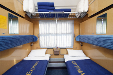 Couchette compartment on Optima Tours motorail train set up as 2-berth